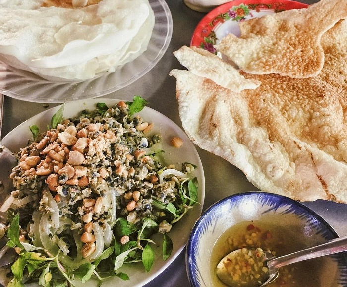 Banh Dap rice crackers served with Cam Nam clams, herbs and peanuts